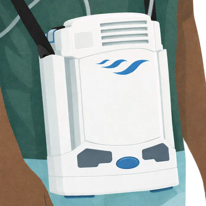 Nahaufnahme eines mobilen Sauerstoffkonzentrators beim Ladevorgang oder Akkubetrieb.